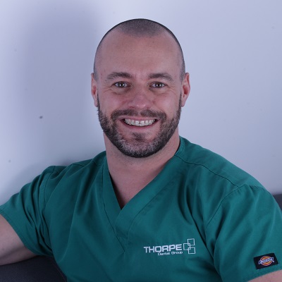 Dr Kris Leeson BChD MJDF RCS (Eng) MSc (Implants) PgCert (Healthcare Education) Portrait